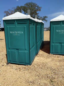 three standard portable toilets